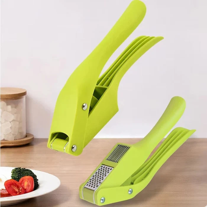 2-in-1 garlic press and slicer in vibrant green color on kitchen countertop with vegetables