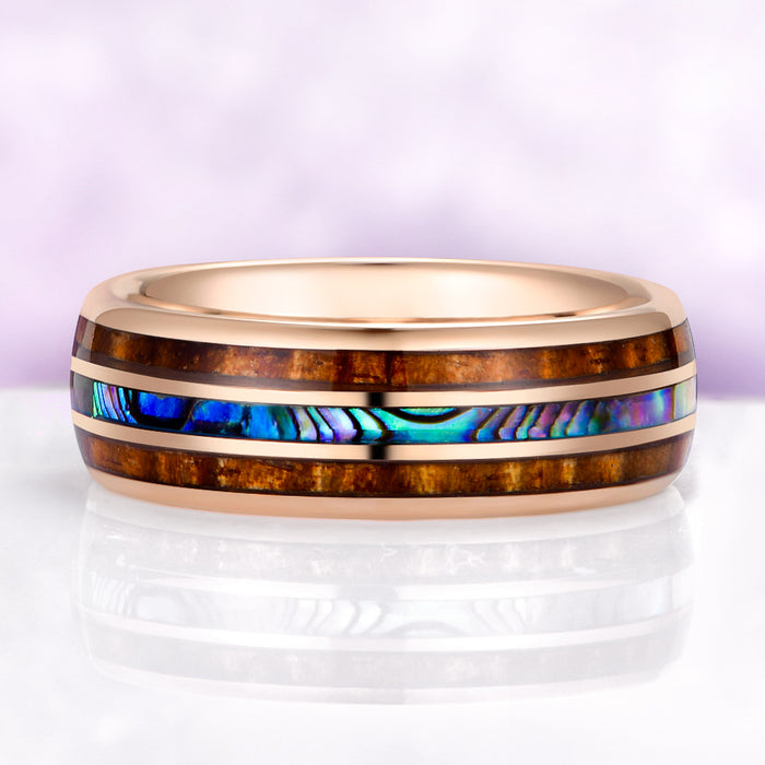 abalone shell tungsten wedding band ocean inspired ring on purple background