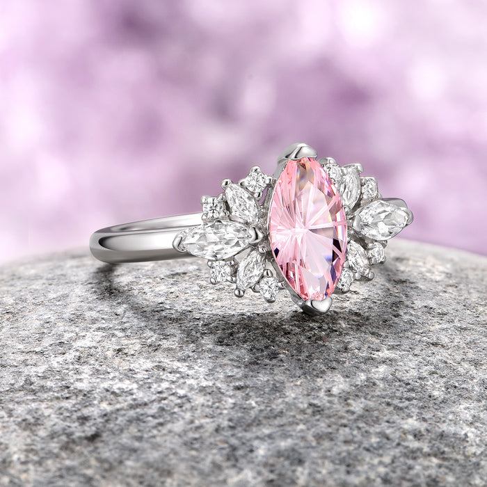 Adeline Unique Fireworks Cut Morganite Couples Ring Set featuring a marquise-cut pink morganite center stone flanked by sparkling crushed diamond cubic zirconia accents on a polished sterling silver band by Aquamarise.