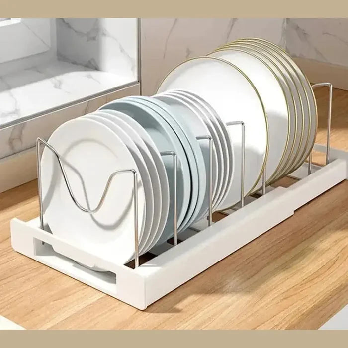 Adjustable pot and pan organizer displaying neatly arranged plates in a kitchen cabinet.