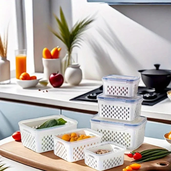Airtight leak-proof food storage containers on a kitchen counter with fresh produce.