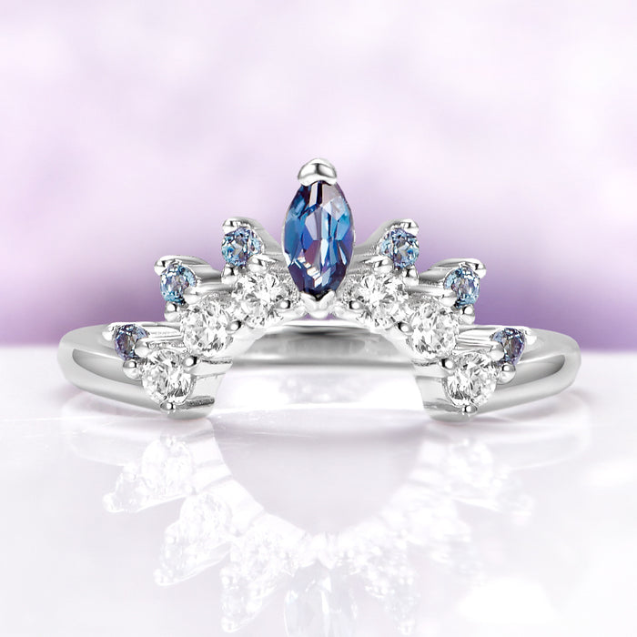 Alexandrite Curved Wedding Band in Sterling Silver by Aquamarise, featuring a marquise-cut alexandrite and sparkling white stones on a curved sterling silver band.