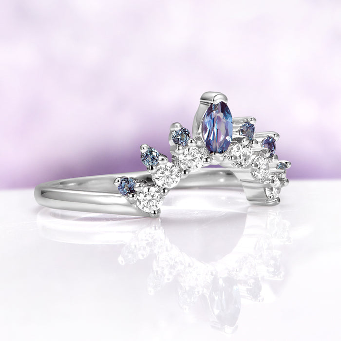 Alexandrite Curved Wedding Band in Sterling Silver by Aquamarise, featuring a marquise-cut alexandrite and sparkling round stones on a curved sterling silver band.