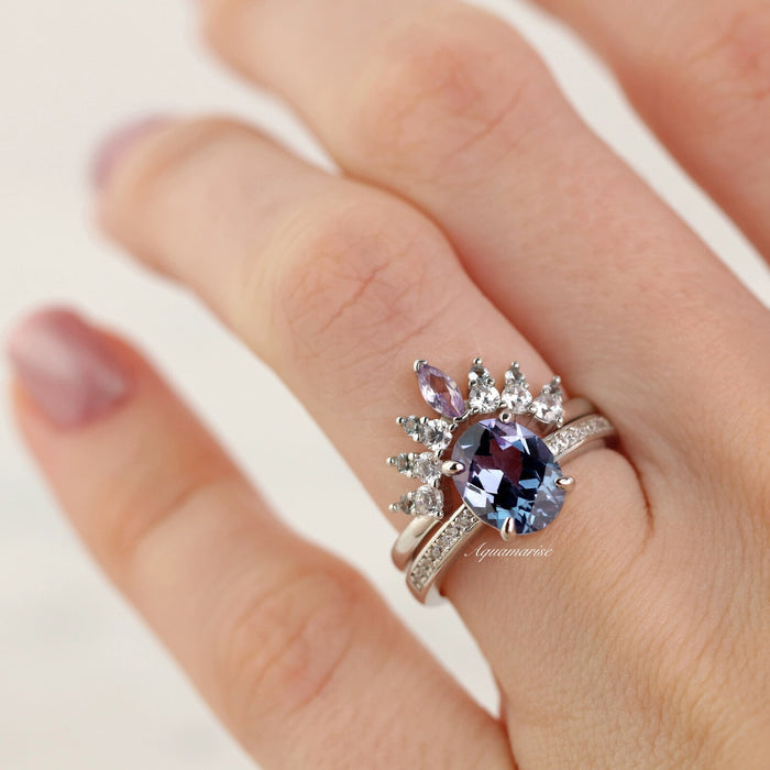 Alexandrite Curved Wedding Band in Sterling Silver by Aquamarise, featuring a pear-shaped alexandrite with a cluster of marquise and round mixed-cut stones on a polished silver band.