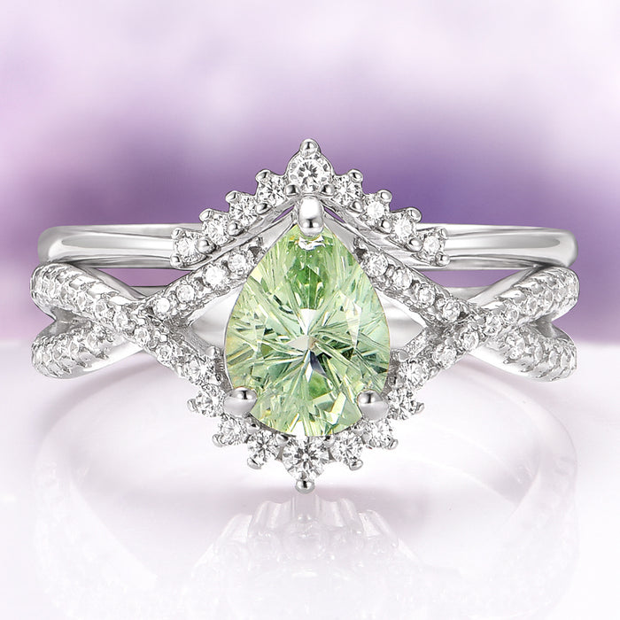 Alice Fireworks Cut Light Green Sapphire Engagement Ring Set in 14K White Gold by Aquamarise Gold featuring a pear-cut light green sapphire surrounded by a sparkling diamond halo on an intricately twisted white gold band, part of Solid Gold Engagement Rings and September Birthstone Jewelry collections.