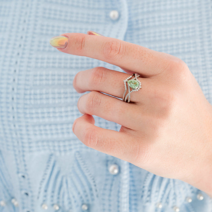 Alice Fireworks Cut Light Green Sapphire Engagement Ring Set in 14K White Gold featuring a pear-shaped light green sapphire surrounded by a diamond halo on a twisted white gold band by Aquamarise Gold, part of Solid Gold Engagement Rings and September Birthstone Jewelry collections.
