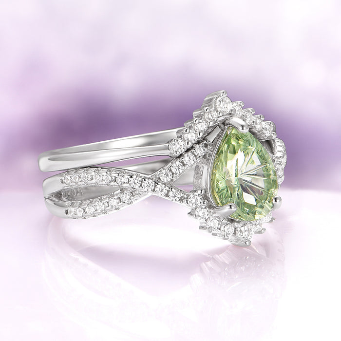 Alice Fireworks Cut Light Green Sapphire Engagement Ring Set in 14K White Gold by Aquamarise Gold featuring a pear-shaped light green sapphire with a diamond halo on a twisted white gold band, perfect for meaningful gifts and fantasy-inspired engagement collections.