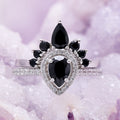 Pear cut black onyx engagement ring set in sterling silver with pave band