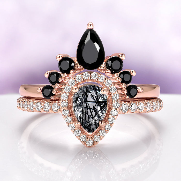 Amy Rutilated Quartz & Black Onyx Ring Set in 14K Rose Gold Vermeil by Aquamarise, featuring pear-shaped rutilated quartz, black onyx stones, and pavé diamonds on elegant rose gold bands.