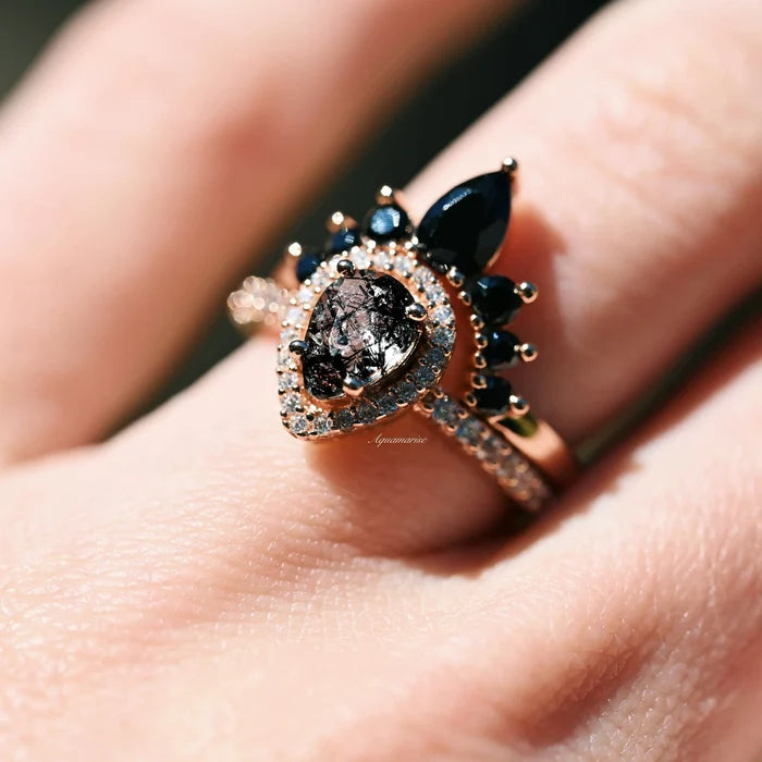 Amy Rutilated Quartz & Black Onyx Ring Set in 14K Rose Gold Vermeil by Aquamarise, featuring a pear-shaped rutilated quartz surrounded by black onyx and pavé stones in a vintage-inspired design.