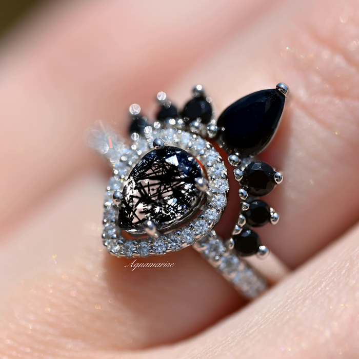 Amy Rutilated Quartz & Black Moissanite Engagement Ring Set in 14K White Gold by Aquamarise Gold, showcasing a teardrop rutilated quartz center with black moissanite and pavé diamond accents