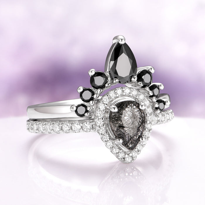 Amy Rutilated Quartz & Black Moissanite Engagement Ring Set in 14K White Gold by Aquamarise Gold, featuring a pear-shaped rutilated quartz center with black moissanite and pavé diamond accents.
