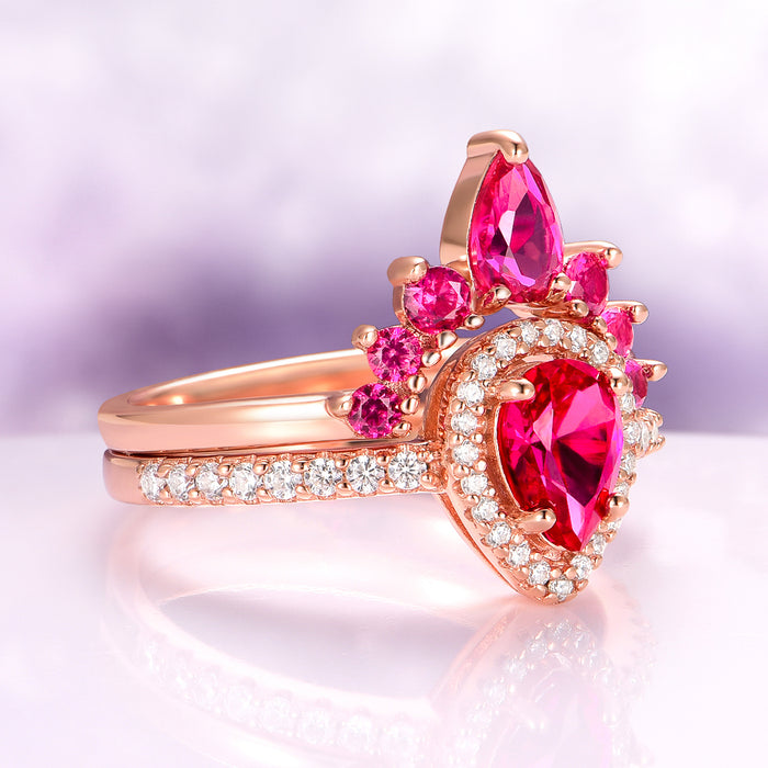 Amy Teardrop Lab-Grown Ruby Ring Set in 14K Rose Gold Vermeil by Aquamarise, featuring pear-shaped rubies and sparkling accent stones on elegant rose gold vermeil bands.