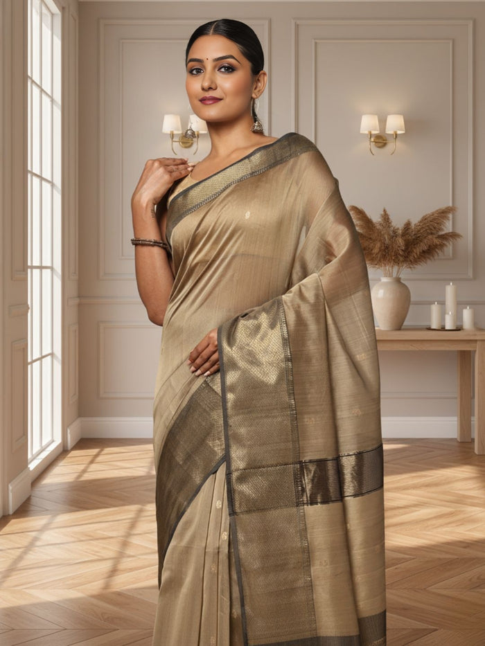 Antique gold Maheshwari silk saree with small buti and a wide charcoal grey pallu border with copper detailing, handwoven in Maheshwar