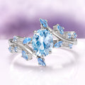 Aquamarine Fairy Leaf Engagement Ring in 14K White Gold by Aquamarise Gold, featuring an oval ice-blue aquamarine center stone surrounded by delicate leaf-shaped accents set in polished 14K white gold, part of collections including Solid Gold Engagement Rings, March Birthstone Jewelry, and Nature-Inspired Engagement Rings.