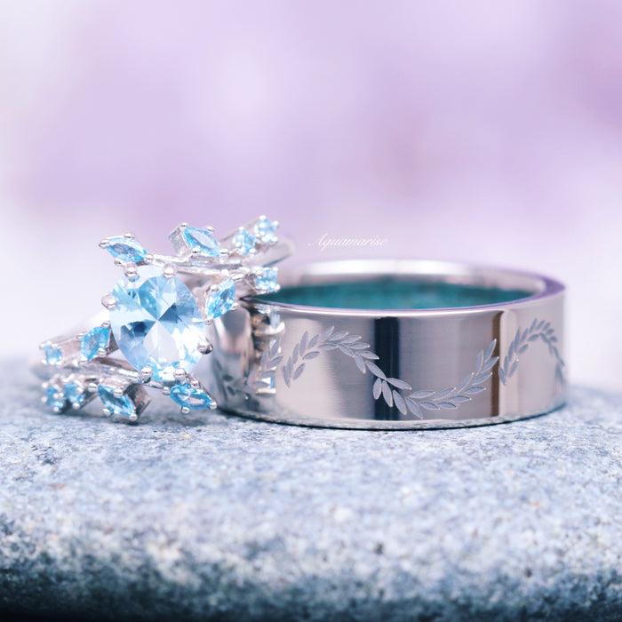 Crushed Aquamarine Leaf Wedding Band- 8MM Titanium featuring a polished titanium band engraved with delicate leaf motifs, paired with a silver ring adorned with sparkling aquamarine stones, showcasing elegant craftsmanship by Aquamarise.