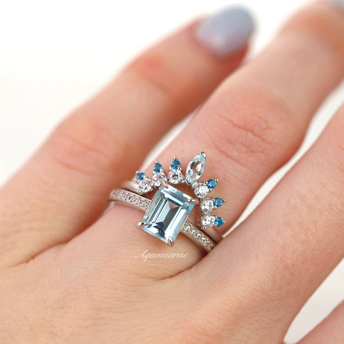 Aquamarine & Swiss Topaz Stacking Ring in Sterling Silver by Aquamarise featuring a rectangular aquamarine center stone accented with alternating marquise and round Swiss blue topaz and clear gemstones on a delicate sterling silver band, ideal for Sterling Silver Rings, March Birthstone Jewelry, Women’s Wedding Bands, and Meaningful Jewelry Gifts collections.