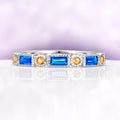 Art Deco Blue Topaz & Citrine Ring in Sterling Silver by Aquamarise, featuring emerald cut blue topaz and round citrine gemstones set in a detailed sterling silver band.