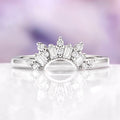 Silver stacking diamond wedding band on purple background