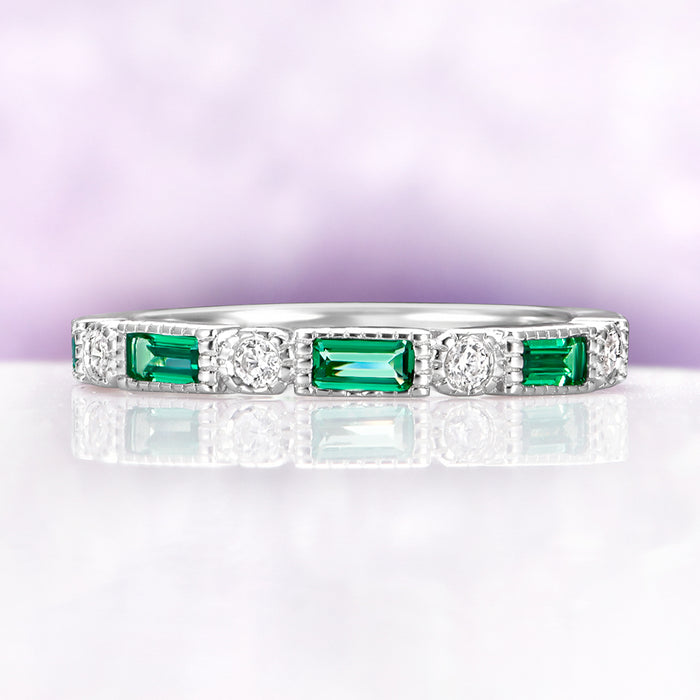 Art Deco Emerald Milgrain Wedding Band in Sterling Silver by Aquamarise, featuring emerald-cut green stones and round diamonds with milgrain detailing on a polished silver band.