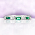 Art Deco Emerald Milgrain Wedding Band in Sterling Silver by Aquamarise, featuring emerald-cut green stones and round diamonds with milgrain detailing on a polished silver band.