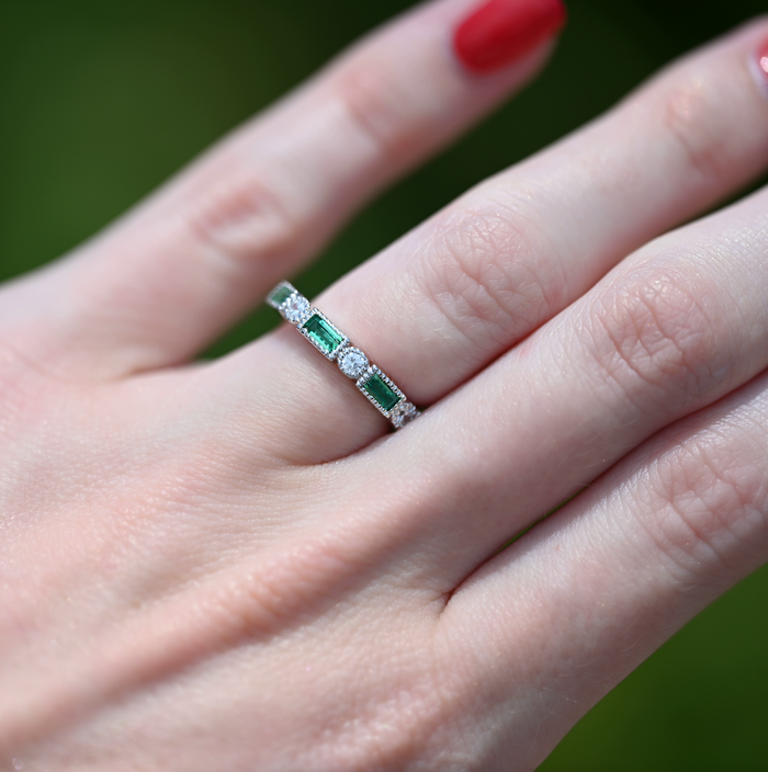 Ari Art Deco Emerald Wedding Band- Sterling Silver by Aquamarise, featuring alternating rectangular simulated emeralds and round simulated diamonds on a polished sterling silver band.