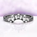 Art Deco Pear Blue Sapphire Ring Set in Black Ruthenium by Aquamarise, featuring black ruthenium band with baguette and round white gemstone accents, a unique black finish engagement ring design.