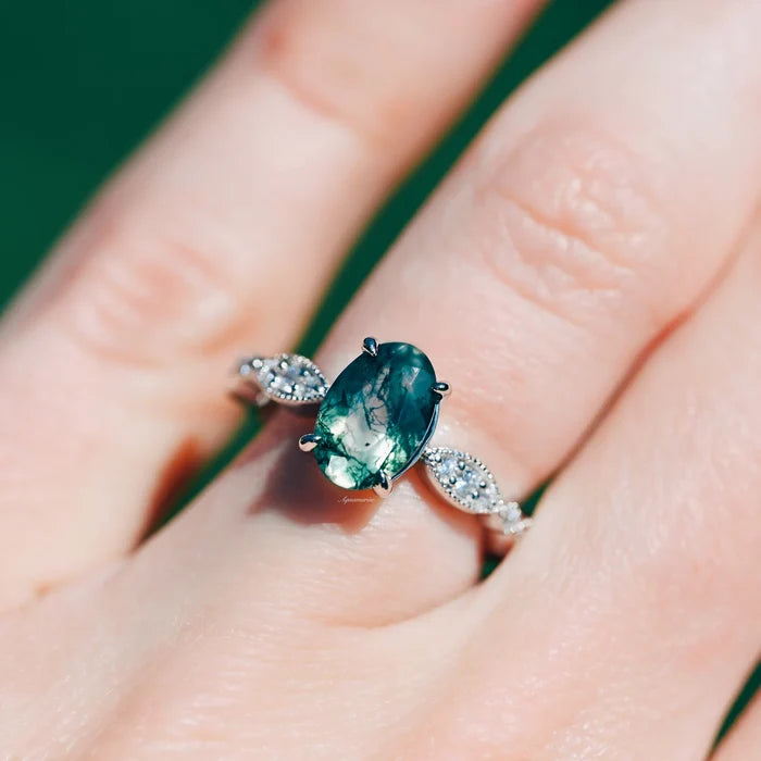 Art Deco Natural Moss Agate Ring in Sterling Silver by Aquamarise, featuring an oval moss agate center with delicate diamond accents on a vintage-inspired band.