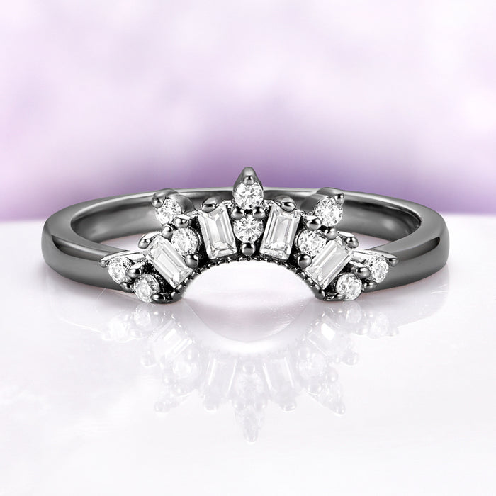 Art Deco Pear Blue Sapphire Ring Set in Black Ruthenium by Aquamarise, featuring black ruthenium band with baguette and round white gemstone accents, a unique black finish engagement ring design.