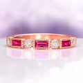 Art Deco Ruby Wedding Band in 14K Solid Rose Gold by Aquamarise Gold, featuring alternating emerald-cut rubies and round-cut diamonds in a vintage-inspired design.