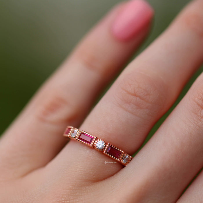 Art Deco Ruby Wedding Band in 14K Solid Rose Gold by Aquamarise Gold, featuring emerald-cut rubies and round diamonds on a delicate vintage-inspired rose gold band.