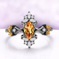 Natural citrine engagement ring in black ruthenium with marquise center and scrolled shoulders