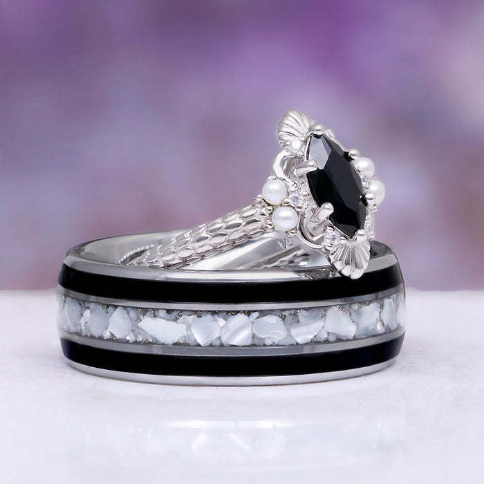 Arwen Black Onyx & Pearl Couples Ring Set by Aquamarise, featuring a marquise black onyx with pearl accents and a band inlaid with white opal and black stone details.