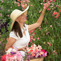 Georgina, founder of Sweet Pea Gardens, offering personalized sweet pea growing advice and gardening consultations.
