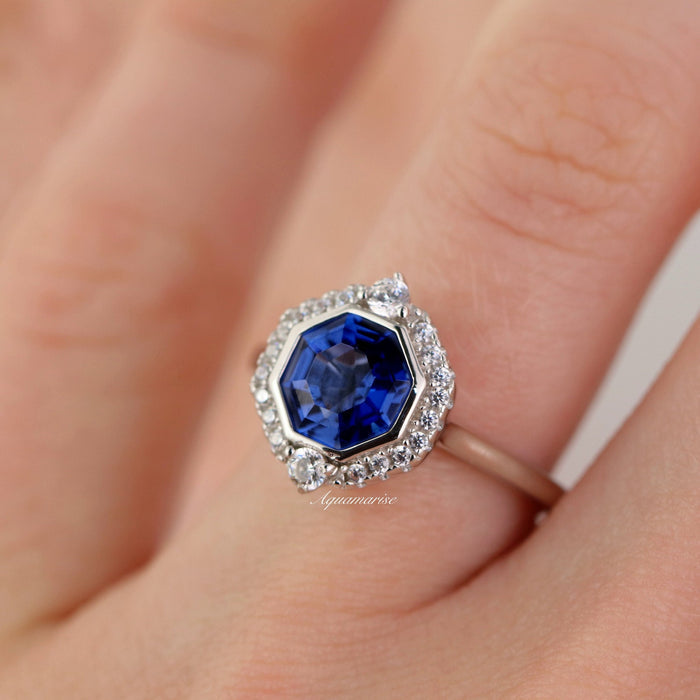 Asscher Cut Art Deco Bezel Set Blue Sapphire Ring in Sterling Silver by Aquamarise, featuring a deep blue sapphire with diamond accents in an art deco bezel design.