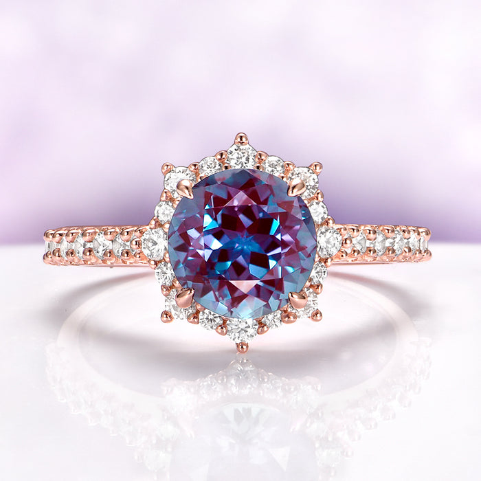 Aster Alexandrite Engagement Ring in 14K Rose Gold Vermeil by Aquamarise, featuring a round alexandrite center surrounded by a halo of diamonds on a pavé diamond rose gold band.