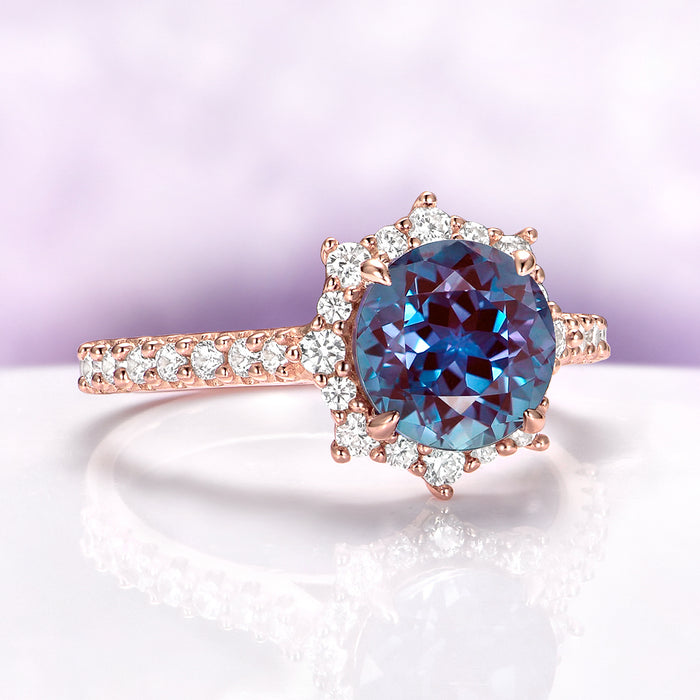 Aster Alexandrite Engagement Ring in 14K Rose Gold Vermeil by Aquamarise, featuring a round alexandrite center stone with a sparkling diamond halo and pavé band details.