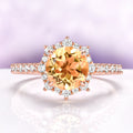 Aster Round Cut Citrine Ring in 14K Rose Gold Vermeil by Aquamarise, featuring a round citrine center with a snowflake halo of simulated diamonds on a pavé rose gold vermeil band.
