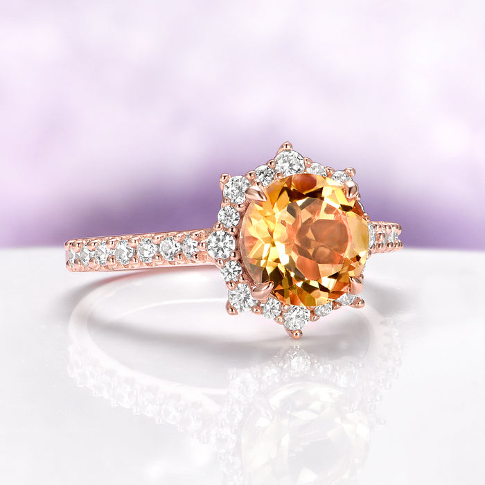 Aster Round Cut Citrine Ring in 14K Rose Gold Vermeil by Aquamarise, showcasing a luminous round citrine with a snowflake diamond halo and pavé band in rose gold vermeil.