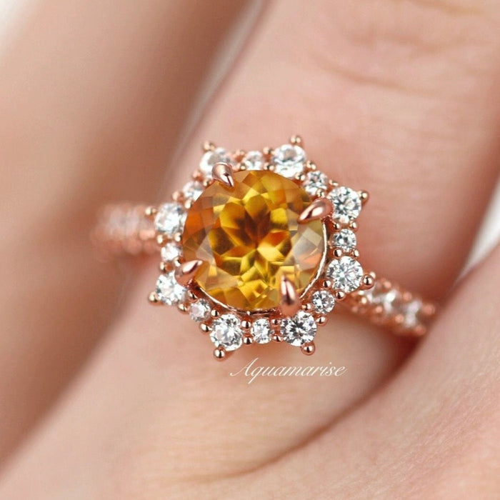 Aster Citrine Ring- 14K Rose Gold Vermeil by Aquamarise, featuring a round natural citrine center surrounded by simulated diamonds on a delicate rose gold vermeil band.