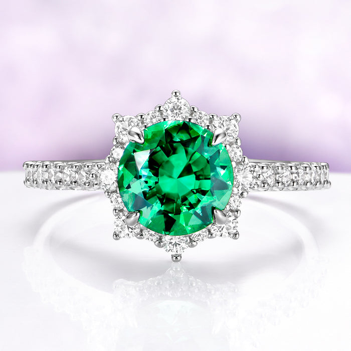 Emerald Engagement Ring Round Emerald Halo Ring over light purple background
