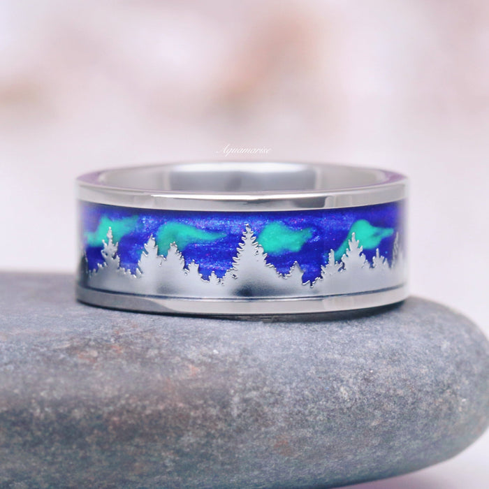 Aurora Borealis Forest Couples Ring Set- Northern Lights & Trees featuring a polished band with an engraved tree silhouette against a vibrant blue and green aurora background by Aquamarise, part of Matching Couples' Rings and Nature-Inspired collections.