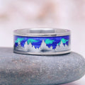 Aurora Borealis Forest Couples Ring Set- Northern Lights & Trees featuring a polished band with an engraved tree silhouette against a vibrant blue and green aurora background by Aquamarise, part of Matching Couples' Rings and Nature-Inspired collections.