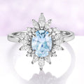 Aurora Oval Halo Aquamarine Ring in Sterling Silver with a 1.4 carat oval aquamarine center, surrounded by a marquise-cut diamond sunburst halo by Aquamarise, elegant fantasy-inspired design.