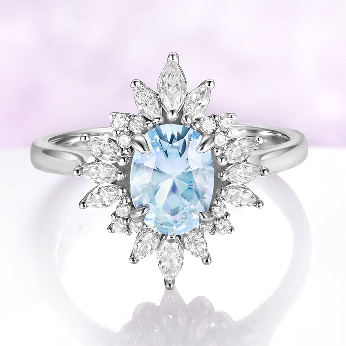 Aurora Oval Halo Aquamarine Ring in Sterling Silver with a 1.4 carat oval aquamarine center, surrounded by a marquise-cut diamond sunburst halo by Aquamarise, elegant fantasy-inspired design.