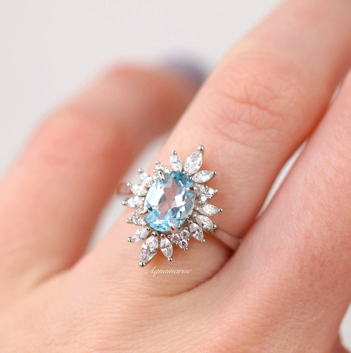 Aurora Aquamarine Ring- Sterling Silver featuring an oval aquamarine center surrounded by marquise and round simulated diamonds on a polished band by Aquamarise.