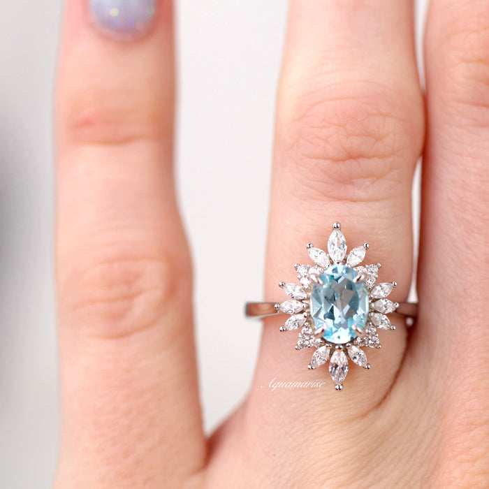 Aurora Aquamarine Ring- Sterling Silver featuring an oval aquamarine center stone framed by marquise and round simulated diamonds on a polished band by Aquamarise.