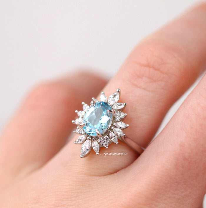 Aurora Aquamarine Ring- Sterling Silver by Aquamarise featuring an oval aquamarine center with marquise and round simulated diamond accents on a polished band, part of Sterling Silver Rings.