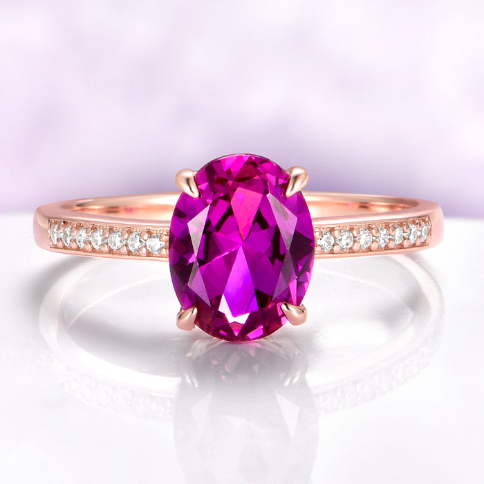 Ava Pink Tourmaline Engagement Ring in 14K Rose Gold Vermeil by Aquamarise, featuring an oval pink tourmaline center stone with diamond accents on a delicate rose gold vermeil band.