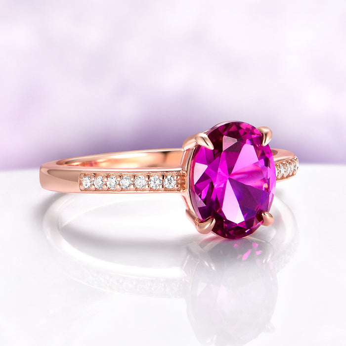 Ava Pink Tourmaline Engagement Ring in 14K Rose Gold Vermeil by Aquamarise, featuring an oval pink tourmaline center with pavé diamond accents on a polished rose gold vermeil band.